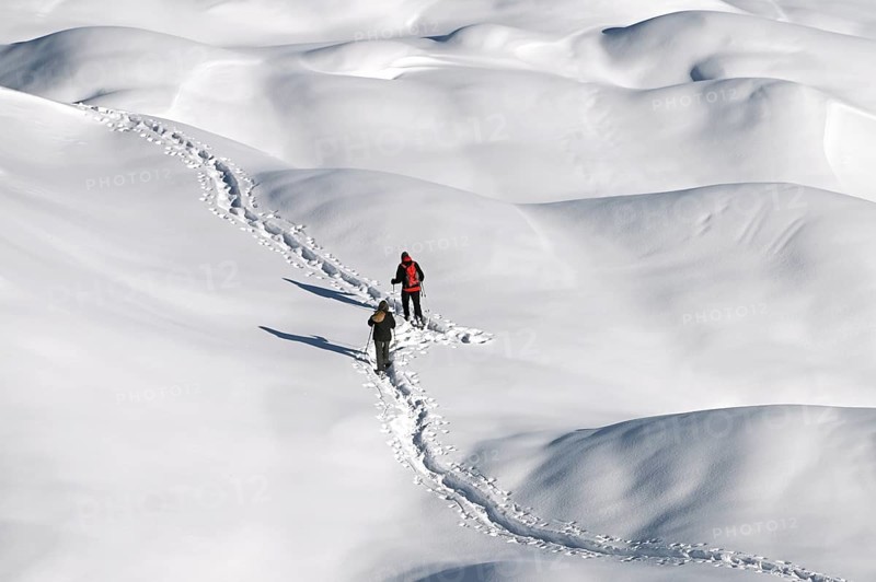 Snowshoe hiking in the Beverin nature park Park, Graubuenden, Switzerland, Europe