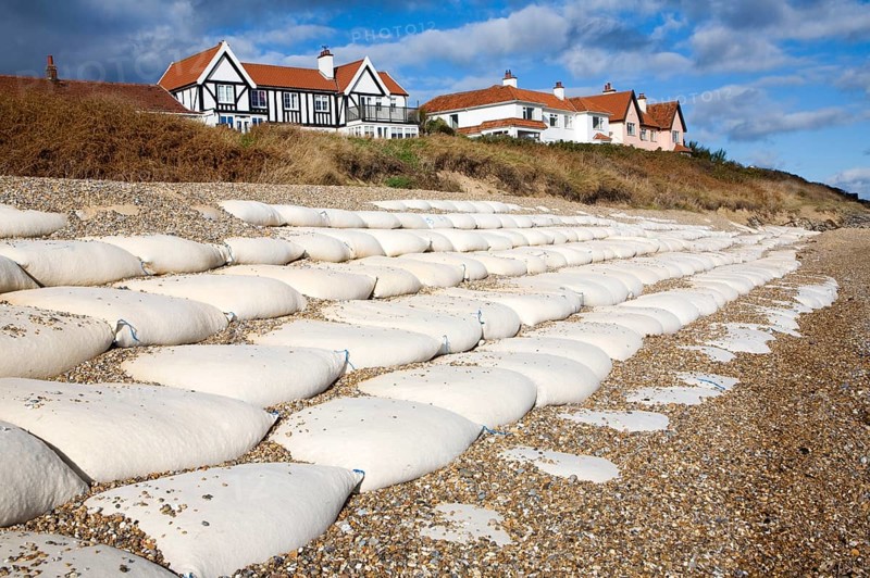 Coastal defences normally covered by shingle exposed by winter storms at Thorpeness, Suffolk, England in November 2013