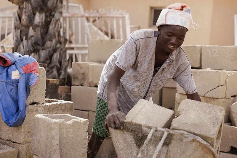 Boy working on a construction site in Nigeria, 06/02/2024