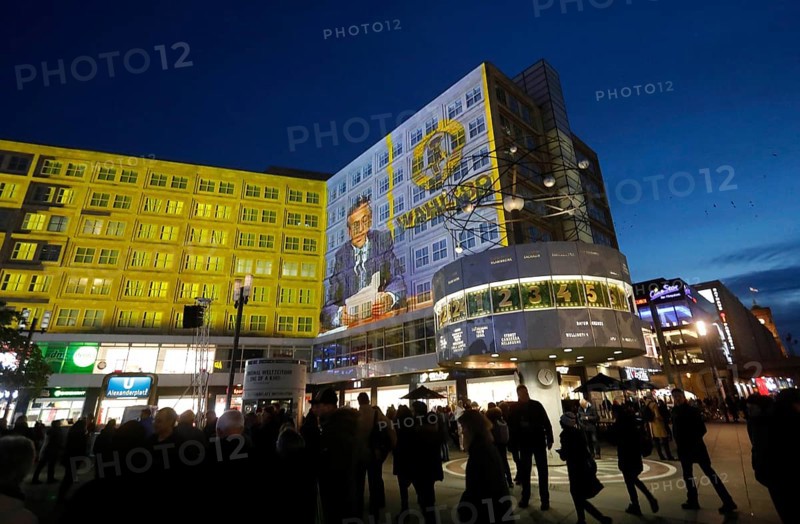 On the 30th anniversary of the fall of the Berlin Wall, 3D video projections of historical images and videos commemorate the events of the Peaceful Revolution and the opening of the Wall at original locations, such as here at Berlin's Alexanderplatz, Egon Krenz, 06.11.2019