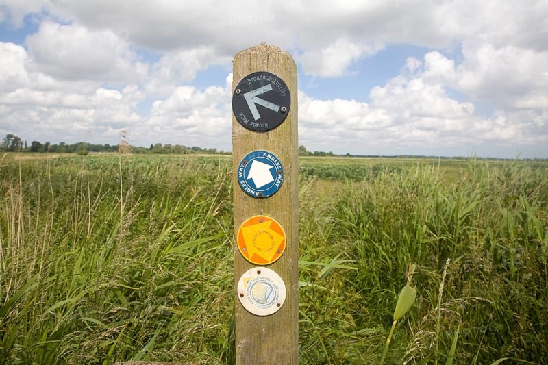 Route markers for Angles Way long distance footpath in marshes near Oulton Broad, Suffolk, England, United Kingdom, Europe