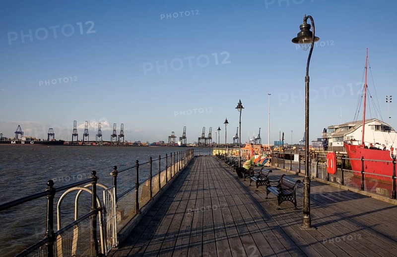 Person enjoying afternoon sunshine Ha'penny pier Harwich, Essex, England, United Kingdom, Europe