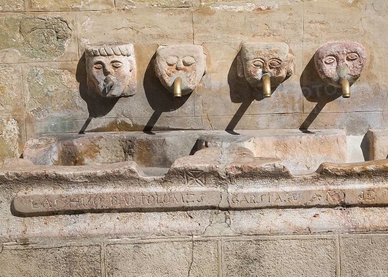 Stone water fountain faces village of Grazalema, Cadiz province, Spain, Europe