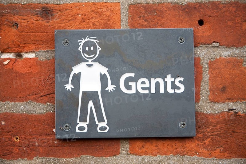 Drawing sign white figure on black slate for Gents toilets, UK