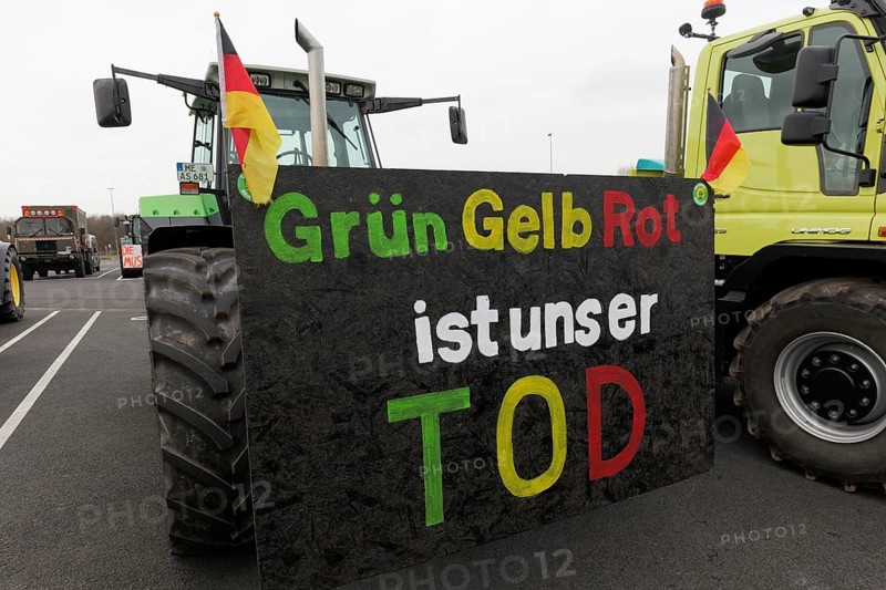 Tractor with sign, Green Yellow Red is our death, farmer protests, demonstration against the policy of the traffic light government, abolition of agricultural diesel subsidies, Duesseldorf, North Rhine-Westphalia, Germany, Europe
