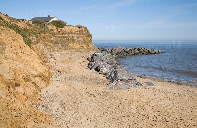 Rock armour used to defend soft crumbling cliffs, Happisburgh, Norfolk, England, United Kingdom, Europe