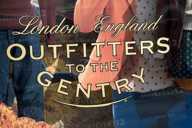 Outfitters to the Gentry shop window sign for an expensive men's clothing shop, Aldeburgh, Suffolk, England, United Kingdom, Europe