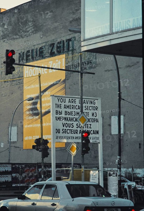 Checkpoint Charlie with building of the Union-Druckerei, a company of the CDU of the GDR, on whose facade old newspaper advertisements can still be seen, around 1999, Friedrichstrasse, Berlin, Germany, Europe