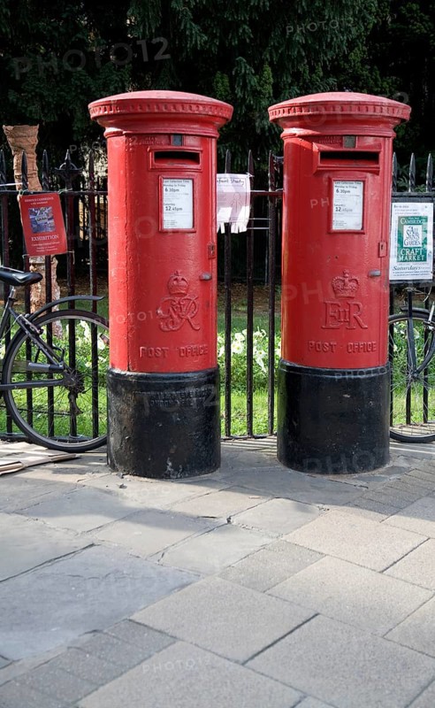Two old traditional red pillar boxes in the street, Cambridge, England, United Kingdom, Europe