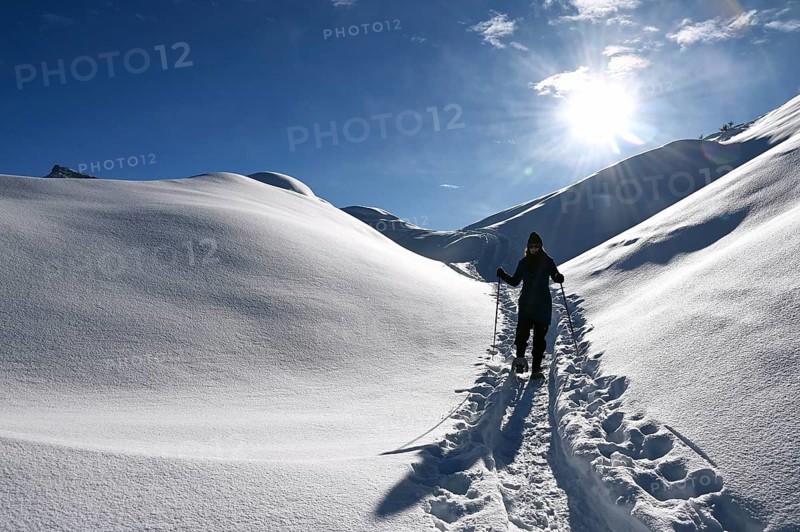 Snowshoe hiking in the Beverin nature park Park, Graubuenden, Switzerland, Europe