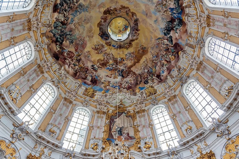 Baroque ceiling fresco with angels and golden ornaments in a magnificent church, Benedictine Abbey of Ettal, Bavaria