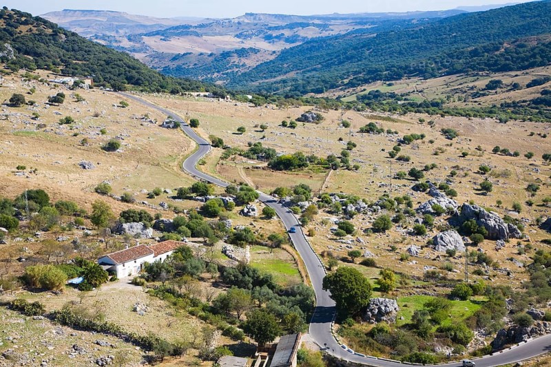 Road running through landscape in Sierra de Grazalema natural park, Cadiz province, Spain, Europe