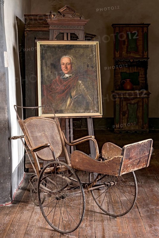Portrait of Ernst Casimir Count of Ysenburg and Buedingen, painting on easel, old Thonet wheelchair around 1900, junk, knight's castle from the Middle Ages, Ronneburg Castle, Ronneburg hill country, Main-Kinzig district, Hesse, Germany, Europe