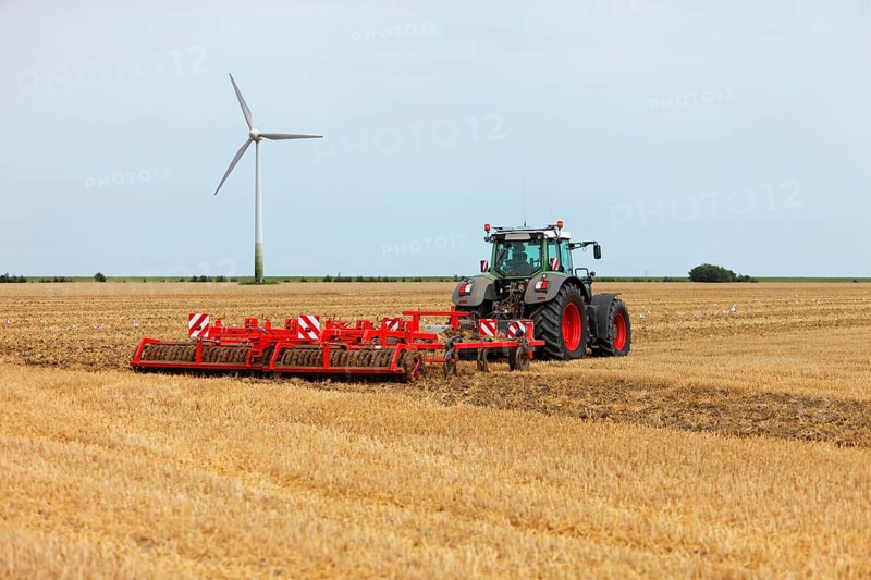 Tractor with harrow