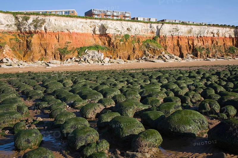 Chalk, red chalk and carstone form striped cliffs of white, red and orange at Hunstanton, Norfolk, England, United Kingdom, Europe