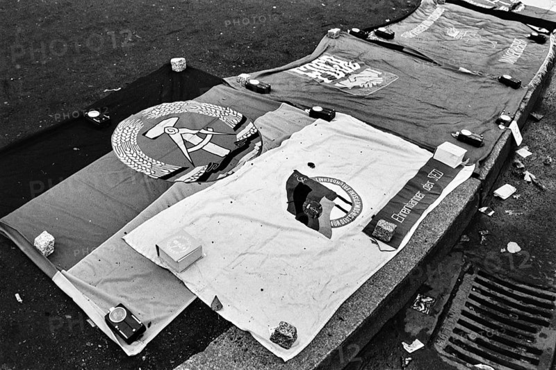 GDR flags on sale in October 1990 at the flea market at Potsdamer Platz, Berlin, Germany, Europe