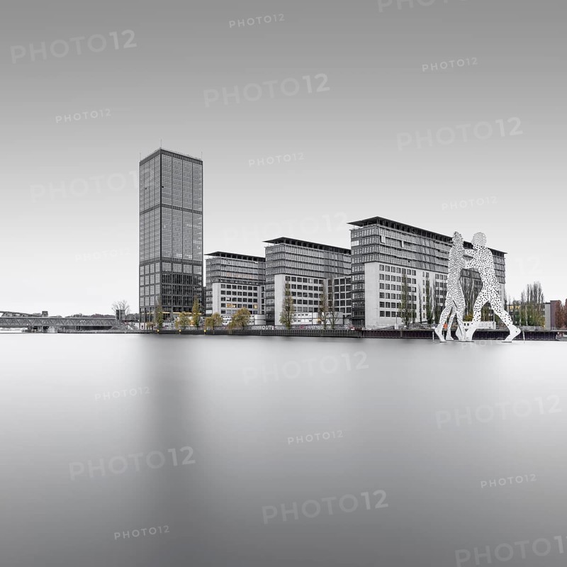 The Treptowers and the Denkaml Molecule Men in Berlin Treptow on the Spree at the Blue Hour