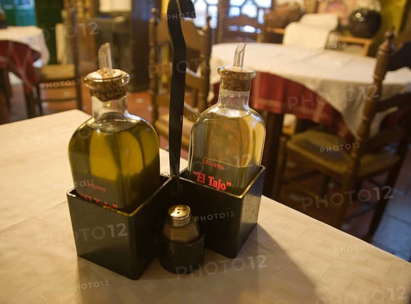 Olive oil condiments on cafe table Spain