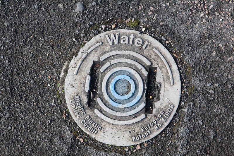 Plastic cover to water main from above, UK