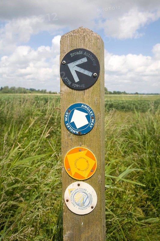 Route markers for Angles Way long distance footpath in marshes near Oulton Broad, Suffolk, England, United Kingdom, Europe