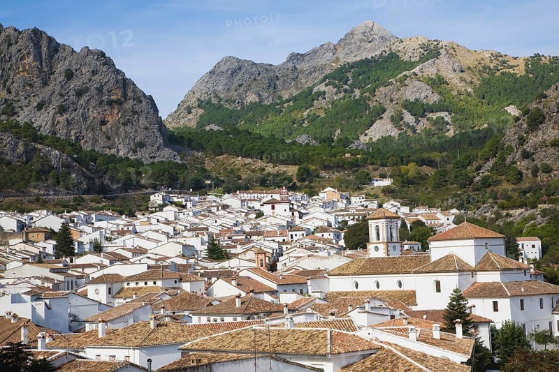 Limestone mountain peaks tower over the Village of Grazalema, Cadiz province, Spain, Europe