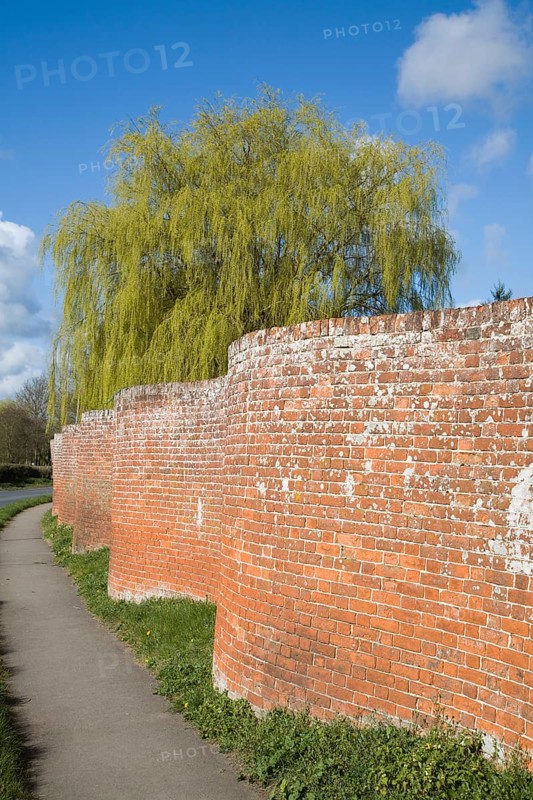 Red brick crinkle crankle or serpentine wall at Easton, Suffolk, England, United Kingdom, Europe