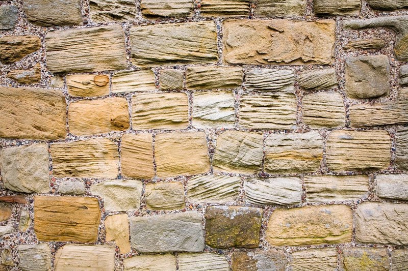 Grooves cut in sandstone blocks by wind erosion at Tynemouth priory, Northumberland, England, United Kingdom, Europe
