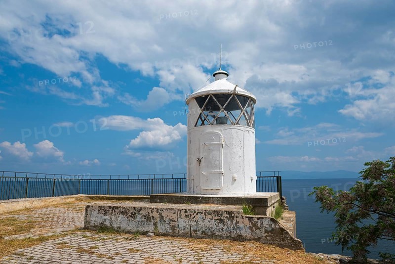 White lighthouse at the edge of a coast with cloudy sky in the background, old town, Kavala, Dimos Kavalas, Eastern Macedonia and Thrace, Gulf of Thasos, Gulf of Kavala, Thracian Sea, Greece, Europe