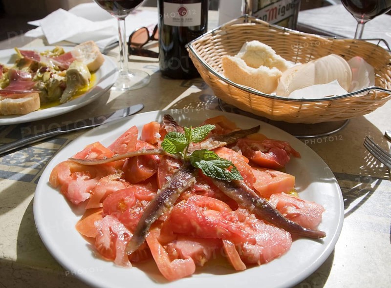 Tomato anchovy salad meal on table, Ronda, Spain, Europe