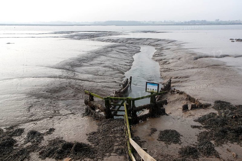 Drainage sluice channel on the River Deben at low tide, Sutton, Suffolk, England, United Kingdom, Europe