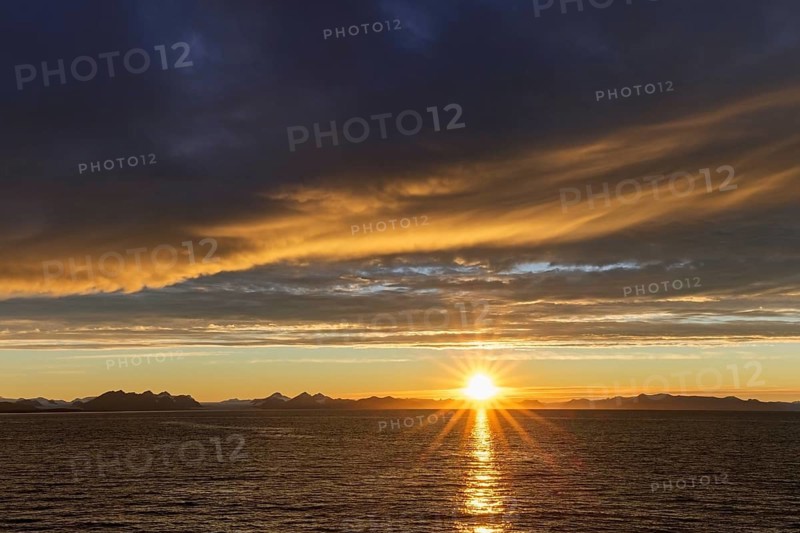 Sun setting on a rainy evening over Isfjorden, Isfjord in summer at sunset, Spitsbergen, Svalbard, Norway, Europe