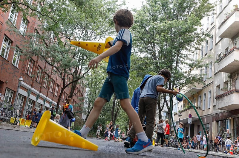 Temporary play street in Berlin Kreuzberg, children playing on a closed street, 07.08.2019