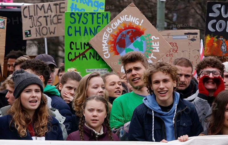 Climate activists Luisa Marie Neubauer (left) and Greta Thunberg demonstrate with thousands of students in Berlin during a Friday for Future demo for the fight against global warming, 29 March 2019