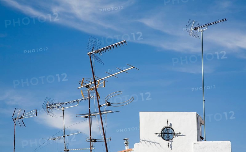 Confused mrs of TV aerials on rooftop in Ronda, Spain, Europe