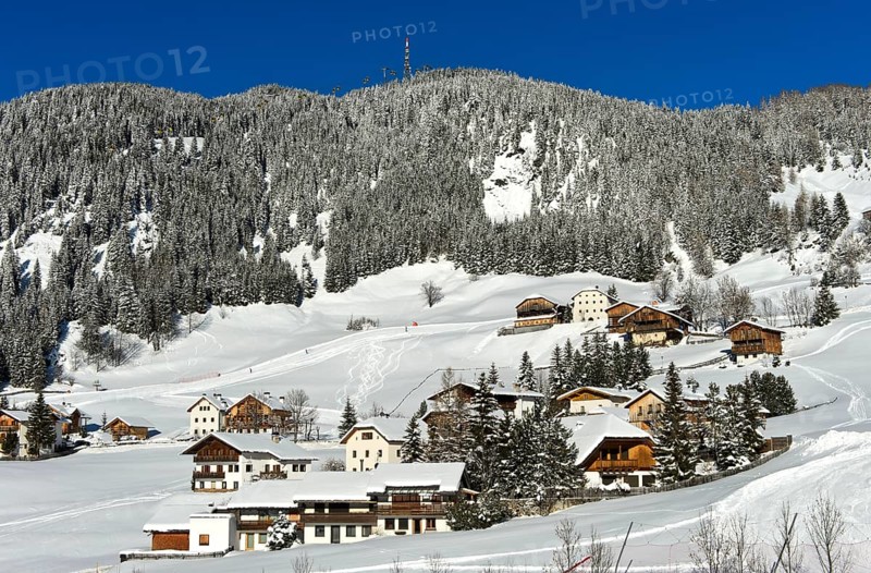 The mountain village of Corvara, Kurfar, at the foot of the Col Alto high plateau in winter, Alta Badia ski area, Dolomites, South Tyrol, Italy, Europe