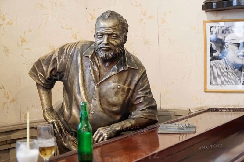 Bronze statue of Ernest Hemingway in the Bar Floridita, Hemingway's favourite bar, in the old town of Habana Vieja, Havana, Cuba, Caribbean, Central America
