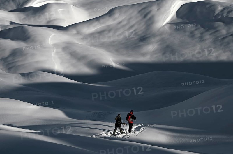 Snowshoe hiking in the Beverin nature park Park, Graubuenden, Switzerland, Europe