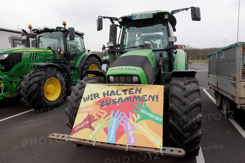 We stick together, sign on a tractor, farmers' protests, demonstration against policies of the traffic light government, abolition of agricultural diesel subsidies, Duesseldorf, North Rhine-Westphalia, Germany, Europe