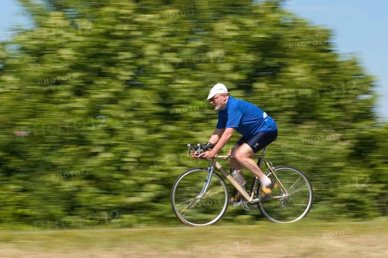 Senior on bicycle, vintage, retro