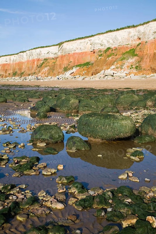 Chalk, red chalk and carstone form striped cliffs of white, red and orange at Hunstanton, Norfolk, England, United Kingdom, Europe
