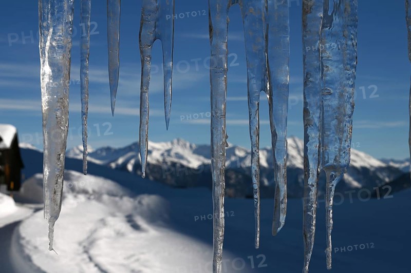 Icicle on a house in the Beverin nature park Park, Graubuenden, Switzerland, Europe