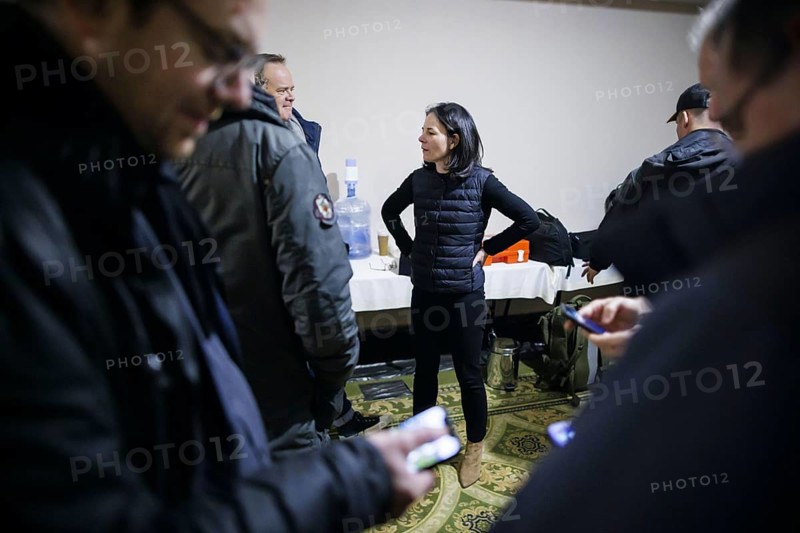 Annalena Baerbock (Alliance 90/The Greens), Federal Foreign Minister, stands in the hotel shelter at night with fellow delegation members and journalists. Odessa, 24.02.2024. Photographed on behalf of the Federal Foreign Office
