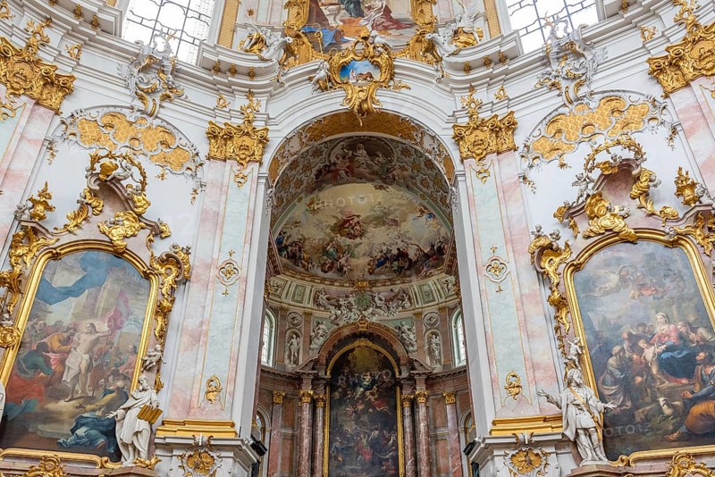 Interior view of a baroque church with richly decorated golden ornaments and ceiling frescoes, Benedictine Abbey of Ettal, Bavaria