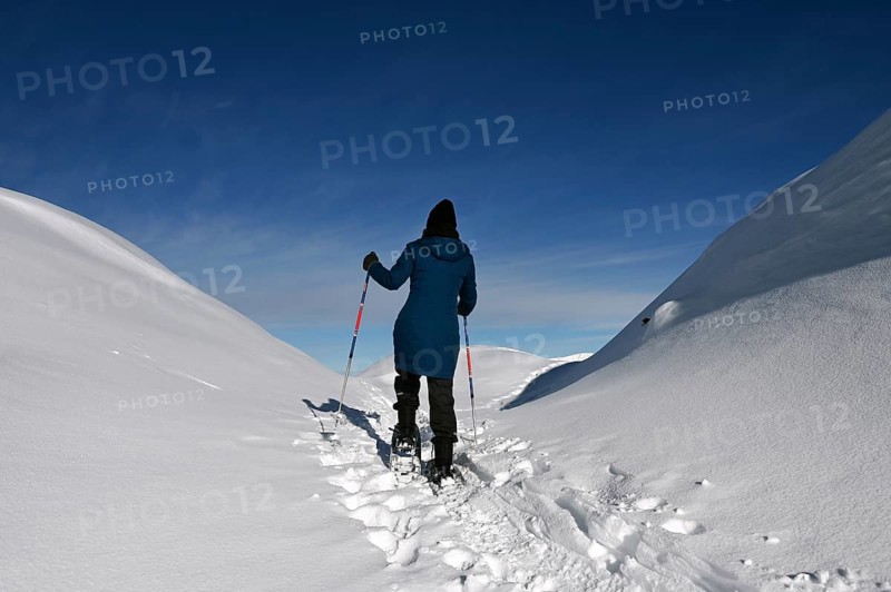Snowshoe hiking in the Beverin nature park Park, Graubuenden, Switzerland, Europe