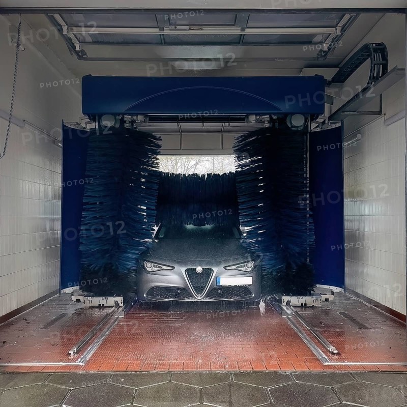 View of a car wash, Alfa Romeo being washed in a car wash with textile brushes, Germany, Europe