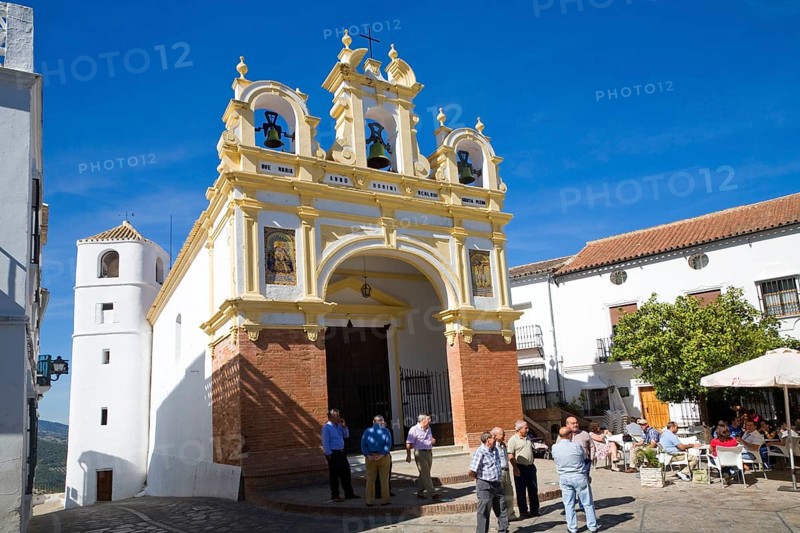 People gather by the baroque church of San Juan at Zahara de la Sierra, Spain Sunday 13 October 2013 after the National Day holiday