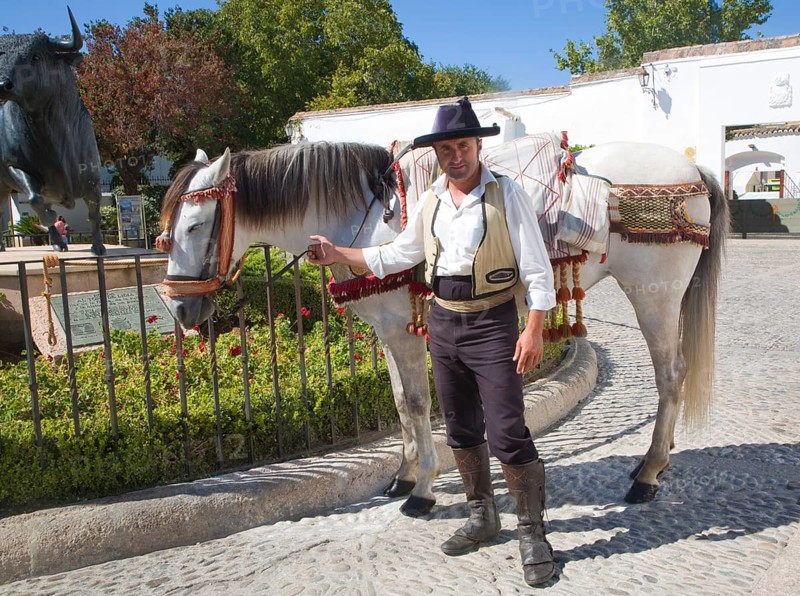 Horseman and his horse in traditional riding clothes near the bullring in Ronda, Spain, Europe