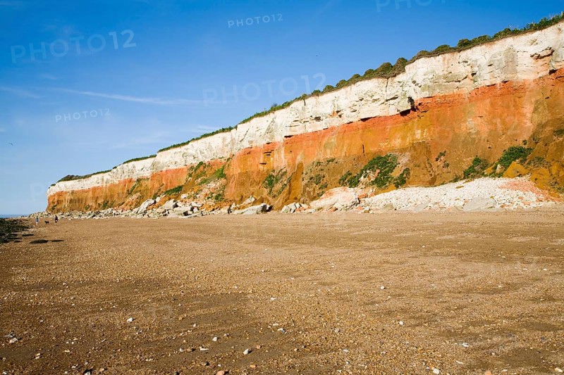 Chalk, red chalk and carstone form striped cliffs of white, red and orange at Hunstanton, Norfolk, England, United Kingdom, Europe