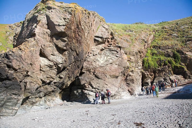 Student group of geologists on a fieldtrip at Polpeor Cove, Lizard Point, Cornwall, England, United Kingdom, Europe