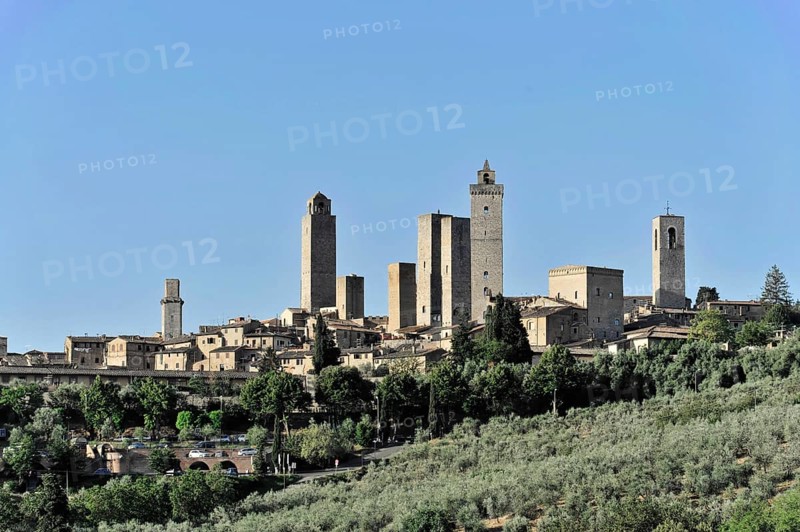Town view, town scape, cityscape of San Gimignano in autumn, gender towers, countryside, in fall, fields of olive trees, wineyards, Tuscany, Italy, Europe